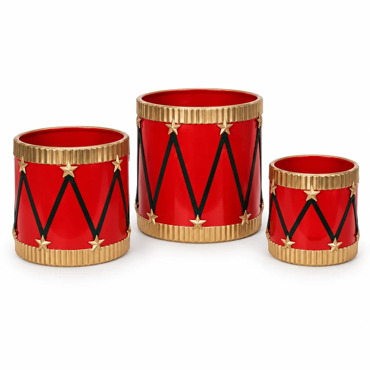 Set of three empty red metal toy drum planters with gold rims on a white studio background.