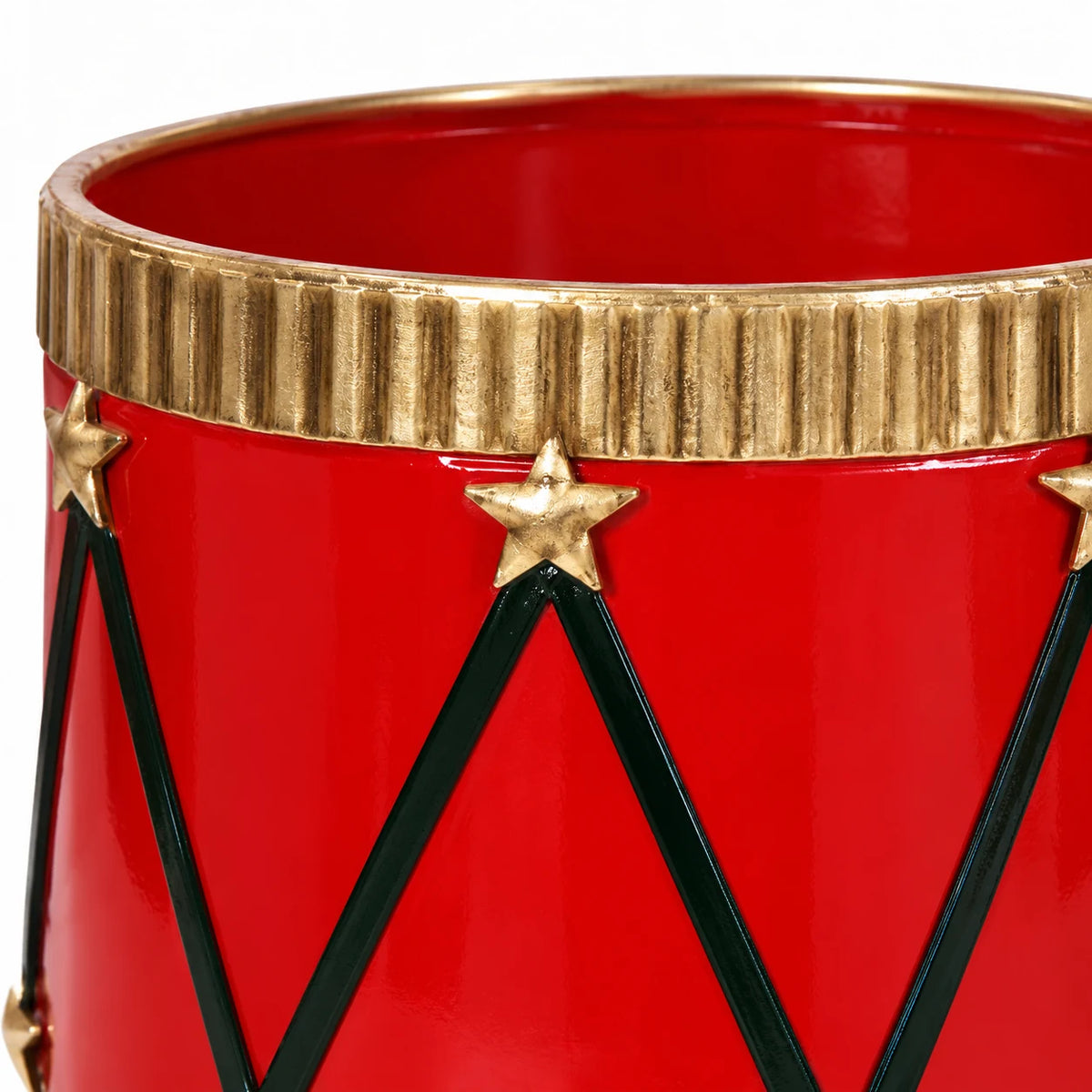 Close-up of the gold fluted rim, star attachment and dark zigzag detailing on a red drum planter.