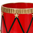 Close-up of the gold fluted rim, star attachment and dark zigzag detailing on a red drum planter.