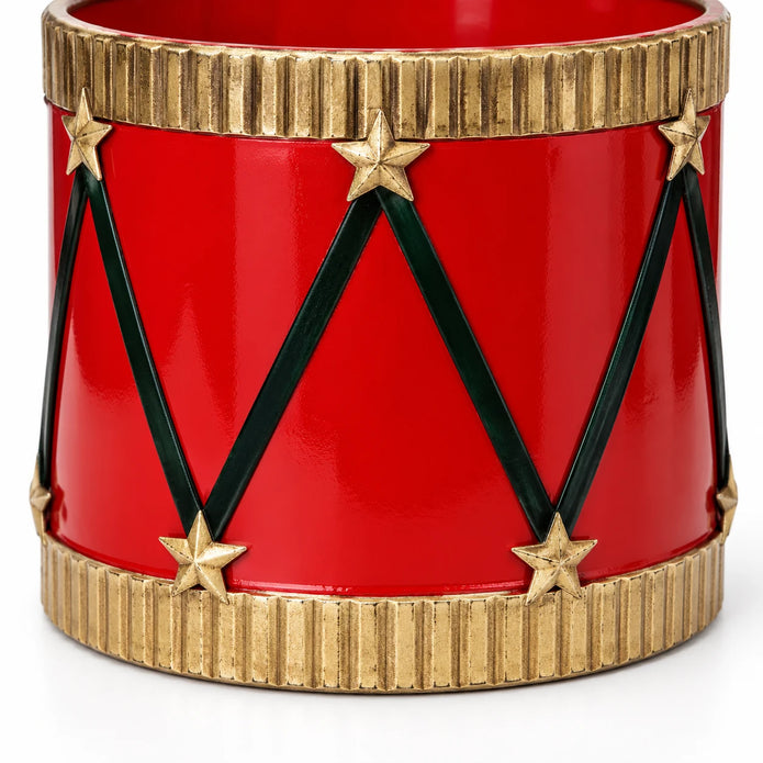 Studio detail of a red drum planter’s dark zigzag lacing, gold stars and lower gold band.