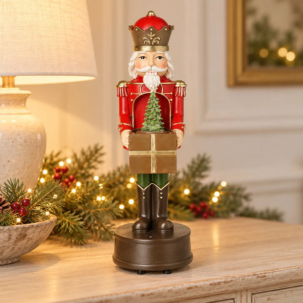 Red musical soldier Christmas decoration on pale sideboard