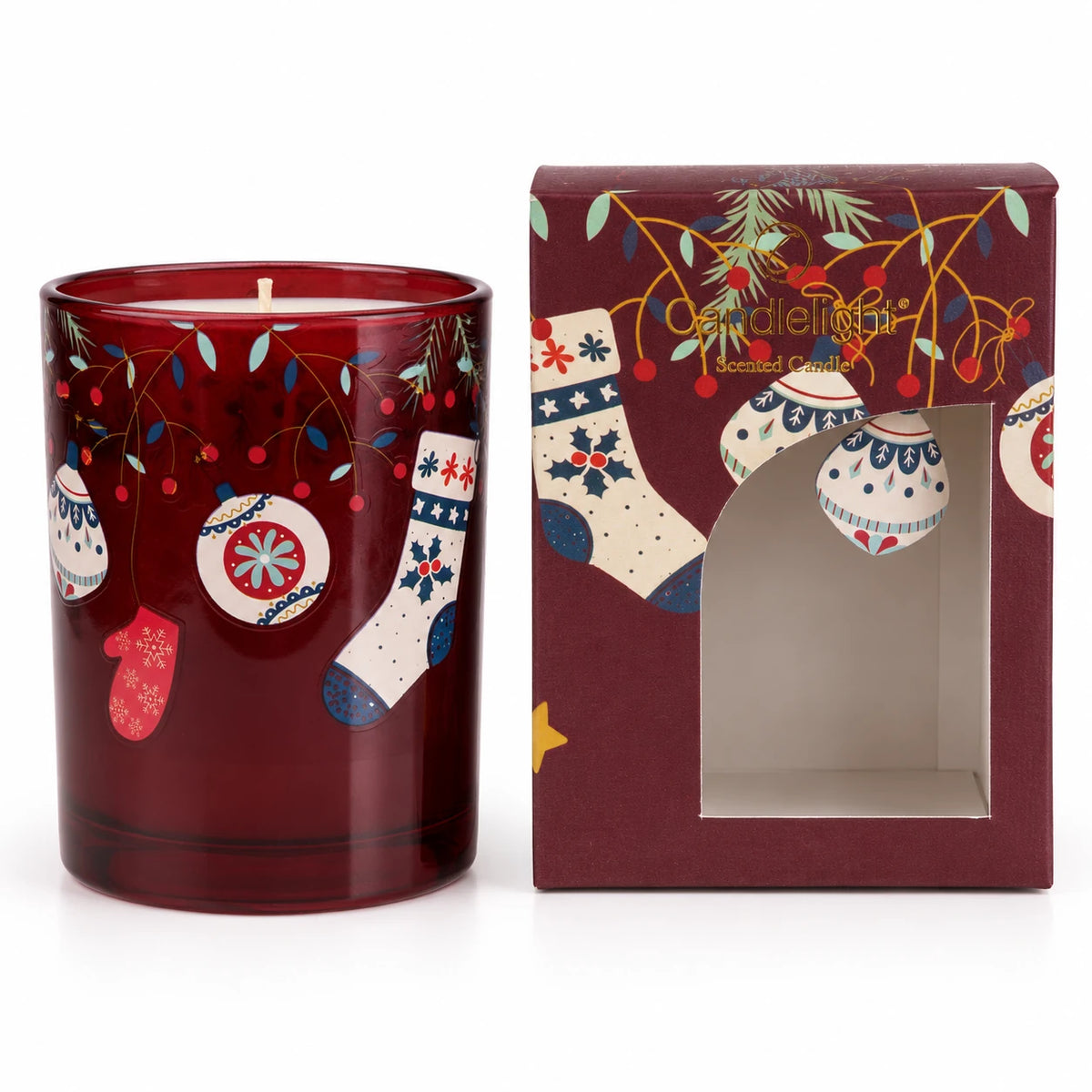 Red Christmas stockings and shiny baubles surrounding a Burgundy Candle from Candlelight Products Ltd on a festive surface.