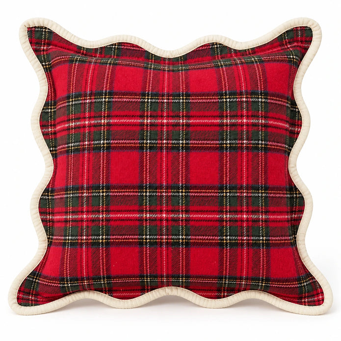 Angled studio view of red tartan cushion cover showing woven texture and cream border