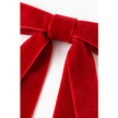 Close-up of red velvet Christmas bow ribbon texture and knot