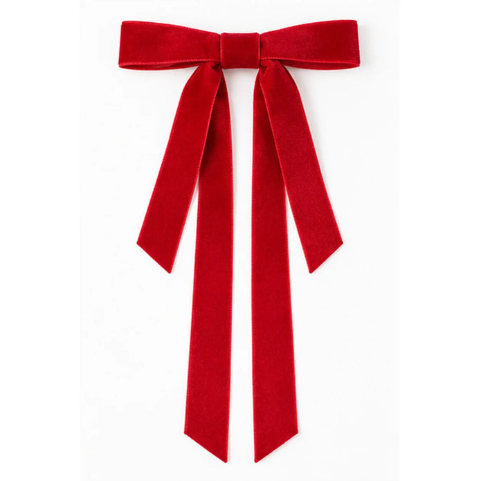 Red long-tail velvet Christmas bow isolated on a white background