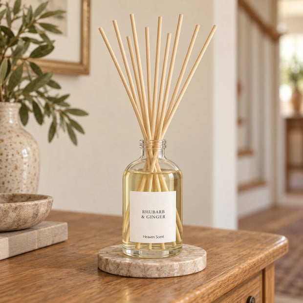 Heaven Scent RHUBARB & GINGER 100ml reed diffuser styled on an oak console with natural reeds inserted.