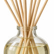 Heaven Scent RHUBARB & GINGER 100ml reed diffuser close-up of natural rattan reeds and the glass bottle neck.