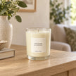 Heaven Scent Rhubarb & Ginger Medium Candle, ivory wax in clear glass on an oak console