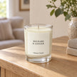 Heaven Scent Rhubarb & Ginger Small Candle, ivory wax in clear glass on an oak console
