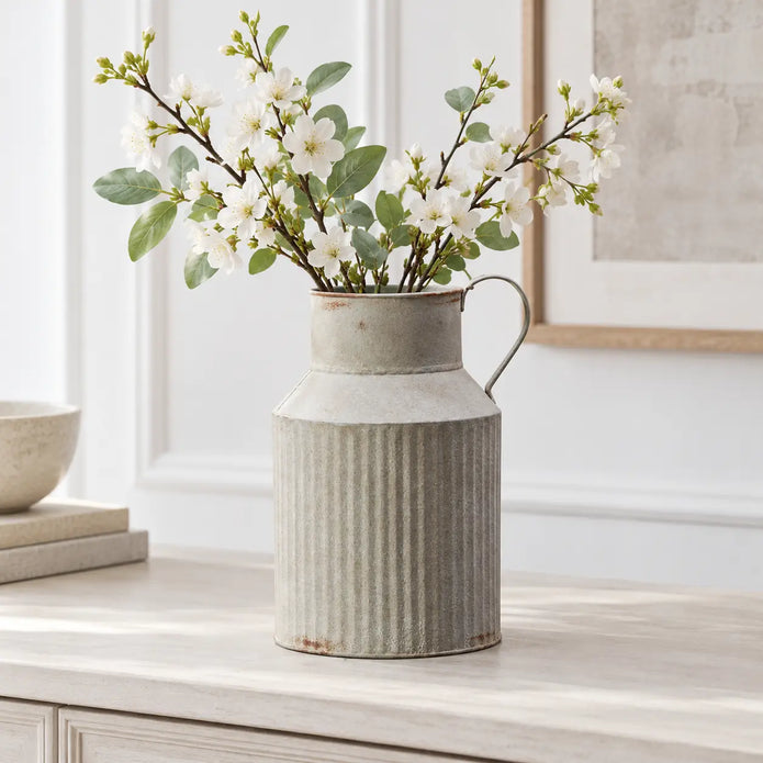 Satchville ribbed metal jug vase with spring blossoms