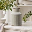 Satchville ribbed metal jug vase displayed on a spring dresser