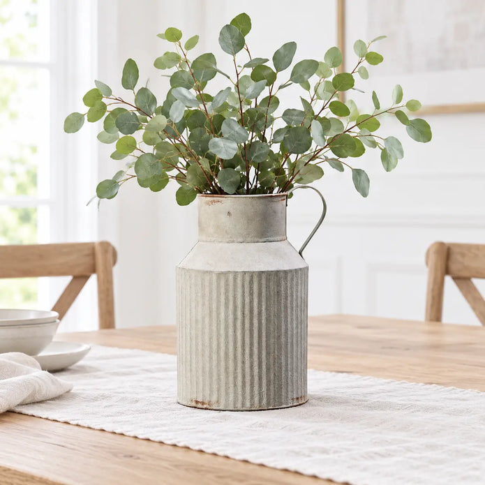 Satchville ribbed metal jug vase with spring eucalyptus stems, textured silver finish