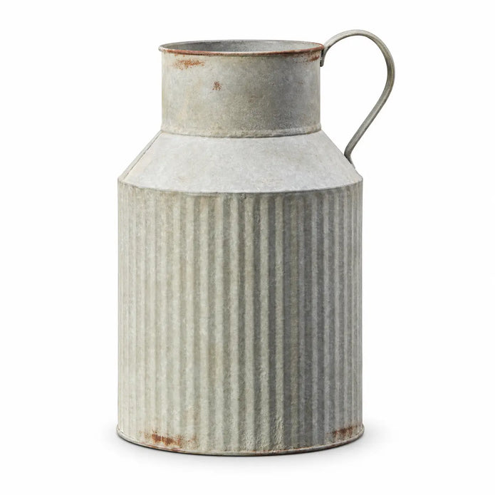 Satchville ribbed metal jug vase with textured vertical ridges, shown in a studio setting