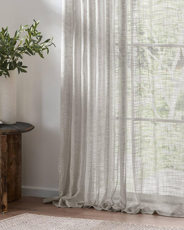Riva Home yard greige woven sheer voile curtain panel with tab top, lightweight soft furnishings for window decor.