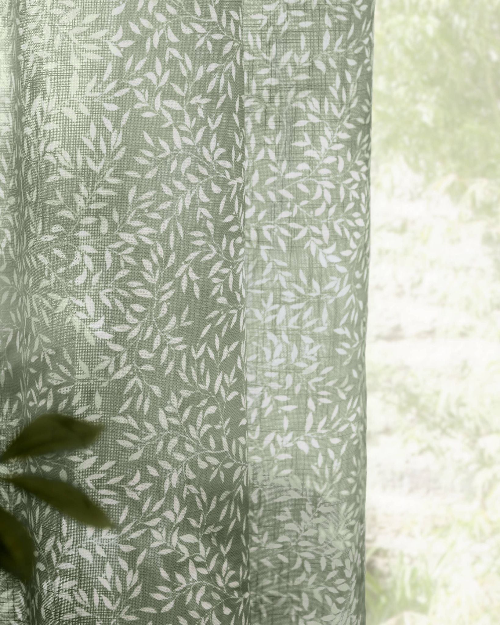 Green woven sheer voile curtain panel with yard leaf pattern, soft furnishings by Riva Home, 140cm wide and 250cm long.