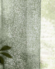 Green woven sheer voile curtain panel with yard leaf pattern, soft furnishings by Riva Home, 140cm wide and 250cm long.