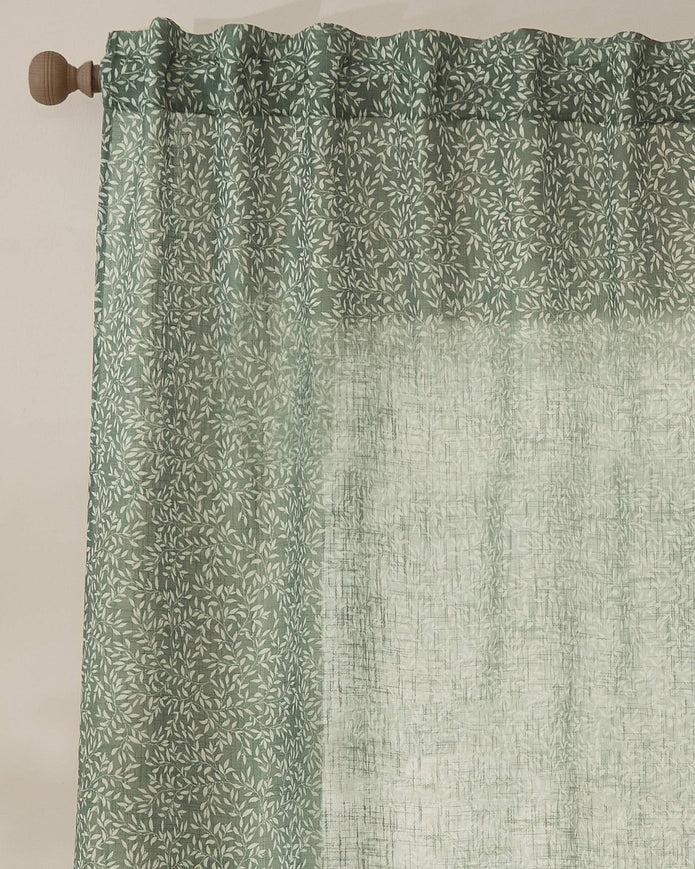 Green woven sheer voile curtain panel with yard leaf pattern, soft furnishings by Riva Home, 140cm wide by 250cm long.