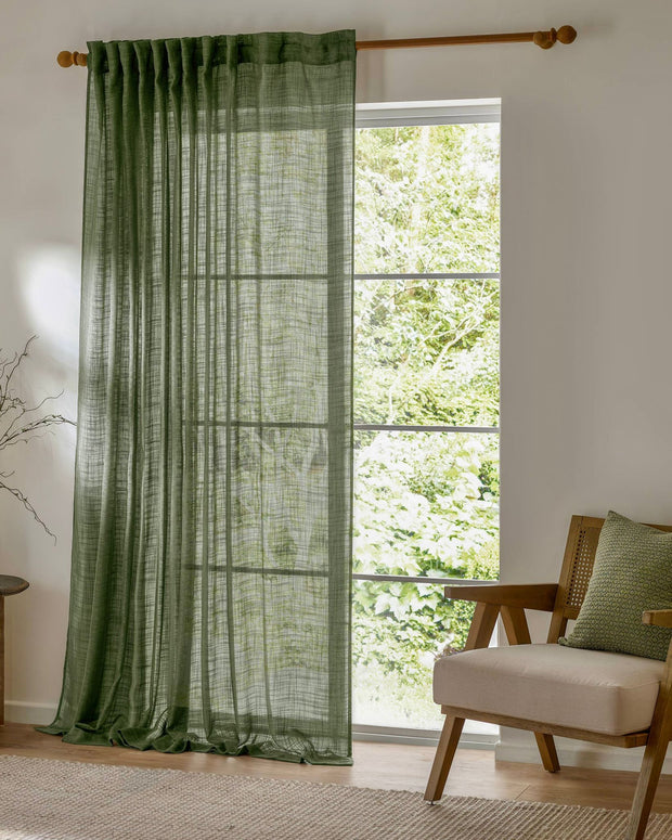 Olive green woven sheer voile curtain panel by Riva Home, soft furnishings, 140cm wide and 250cm long.