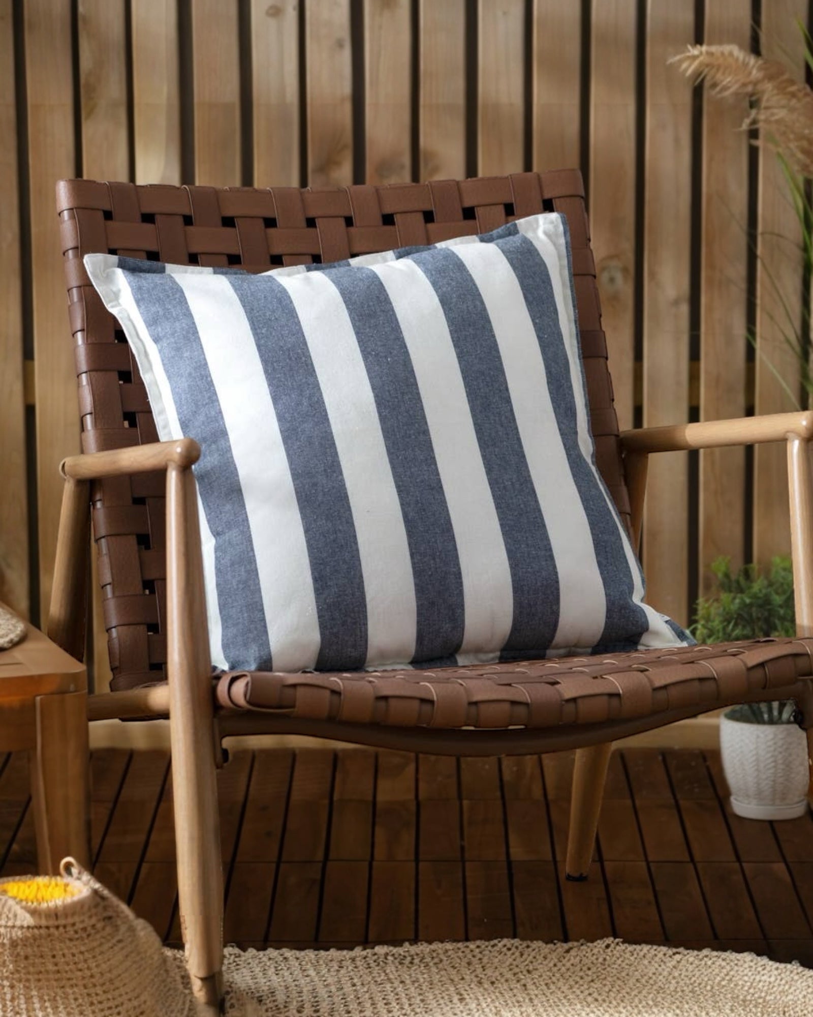 Navy blue striped outdoor garden seat scatter cushion cover from Riva Home, soft furnishings for garden furniture.