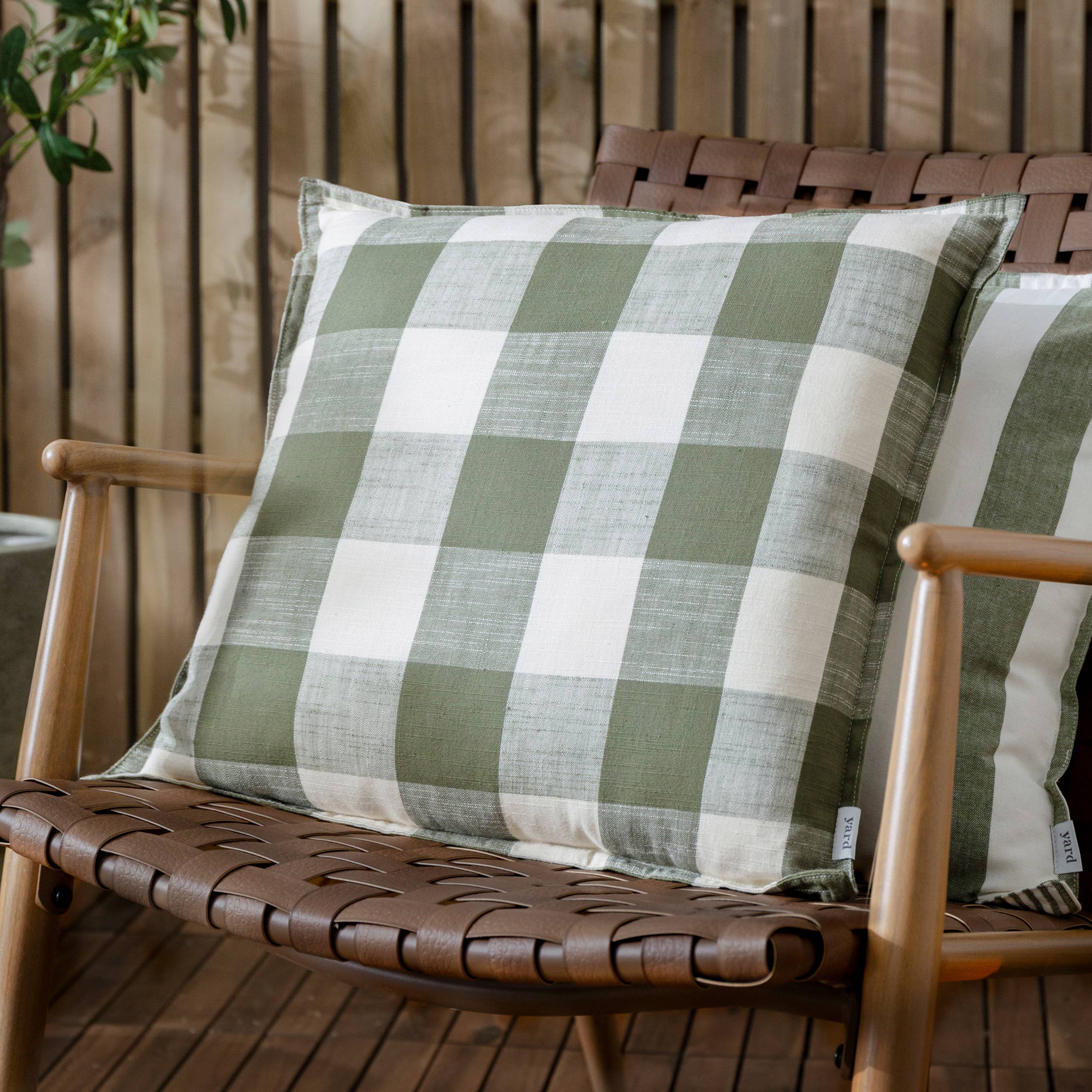 Olive green check outdoor garden seat scatter cushion cover by Riva Home, soft furnishings for outdoor furniture.