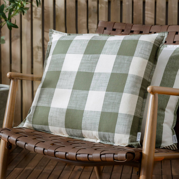 Olive green check outdoor garden seat scatter cushion cover by Riva Home, soft furnishings for outdoor furniture.