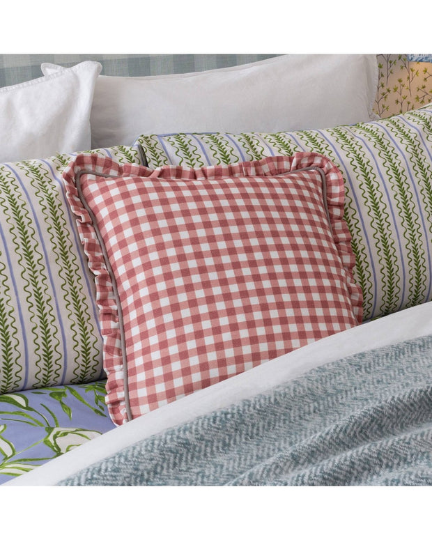 Rose pink Maude Gingham reversible piped cushion from Riva Home, showcasing soft, cozy fabric with piping detail on both sides.
