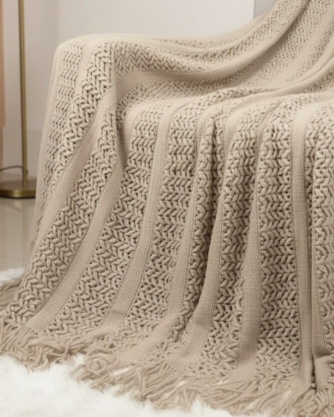 Riva Home beige lightweight throw blanket made of soft furnishings fabric, neutral cream color, cozy and versatile for home decor.