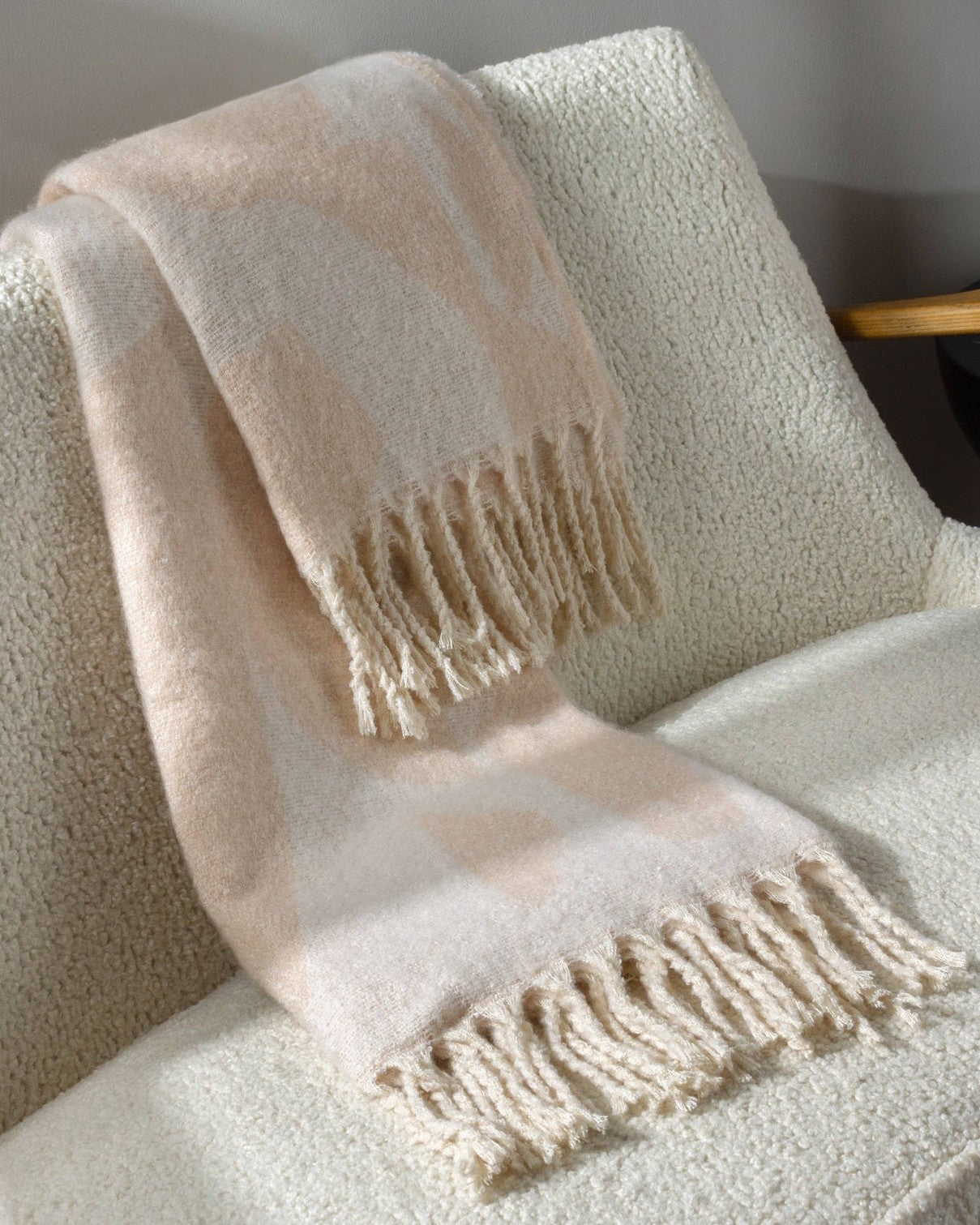 Neutral peach faux mohair geometric throw blanket by Riva Home, featuring soft, cozy textured fabric for stylish home decor.
