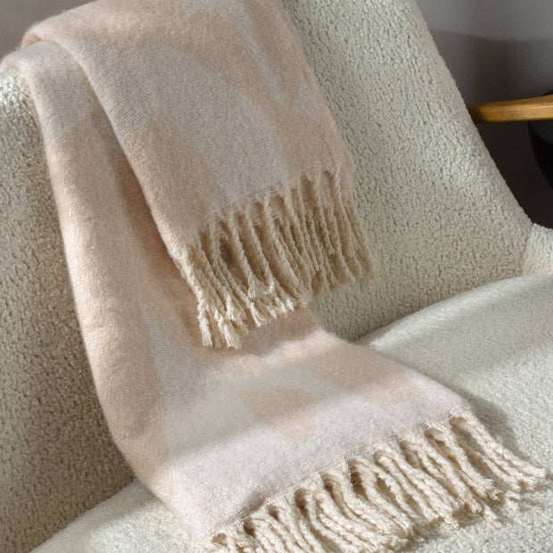 Neutral peach faux mohair geometric throw blanket by Riva Home, featuring soft, cozy textured fabric for stylish home decor.