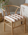 Set of 2 terracotta striped outdoor garden seat pads by Riva Home, soft furnishings for patio or garden seating.