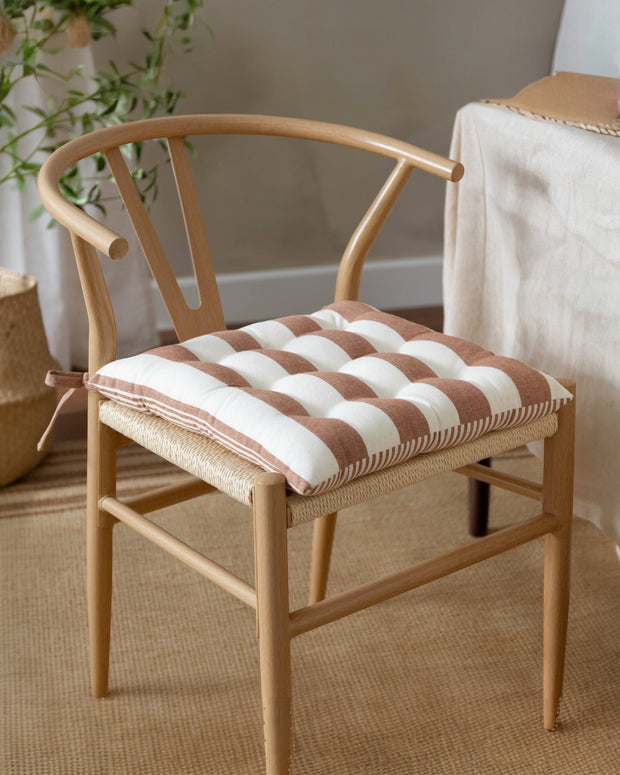 Set of 2 terracotta striped outdoor garden seat pads by Riva Home, soft furnishings for patio or garden seating.