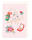 Elegant engagement greeting card featuring champagne design by Rosanna Rossi, perfect for celebrating special moments.