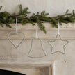 Beaded silver Christmas ornament hanging with intricate bead details, from Heaven Sends for holiday decoration.