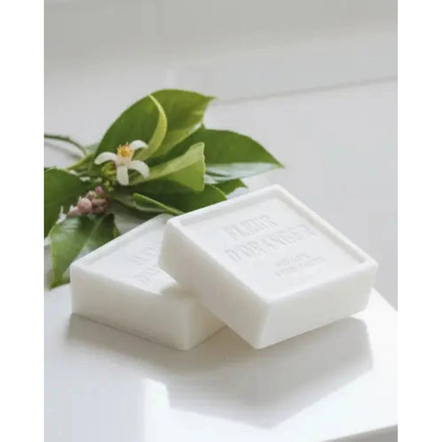 Rustic soap block with fleur d’oranger scent, used as a home fragrance by Terrace & Garden Ltd, shown in a natural setting.