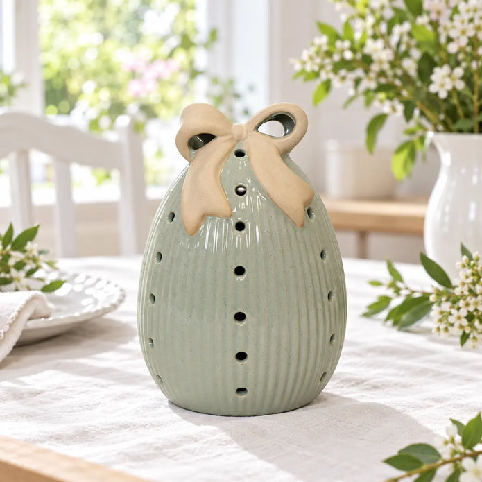 Satchville large sage green ceramic Easter egg with light-up LED and bow on a dining table