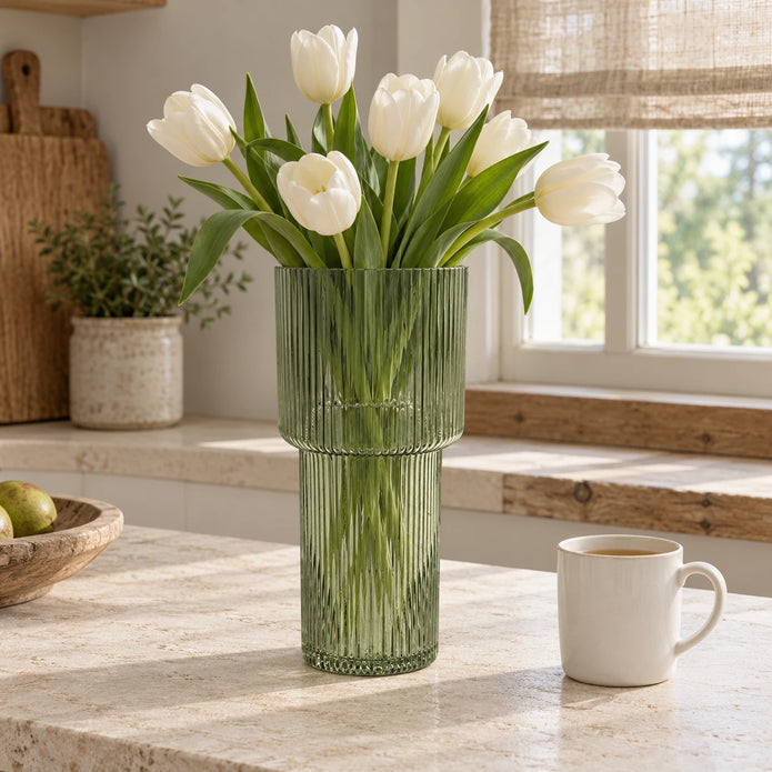 Satchville sage green tall ribbed glass vase with a smooth, curved design, ideal for floral arrangements or decorative display.