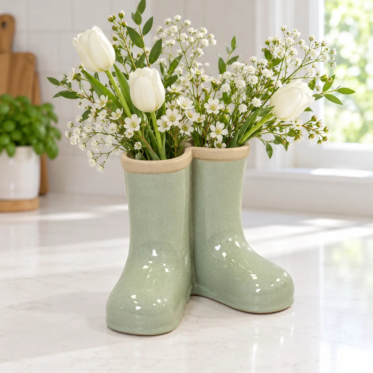 Satchville large sage green ceramic Wellington boot vase with flowers in a kitchen setting