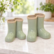 Satchville small sage green ceramic Wellington boot vase beside a larger vase for size comparison
