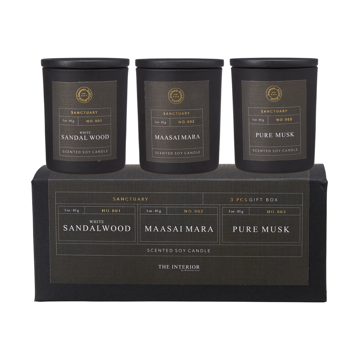 Sanctuary Candles Gift Set of Three in black jars above a gift box, labelled White Sandalwood, Maasai Mara and Pure Musk.