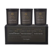 Sanctuary Candles Gift Set of Three in black jars above a gift box, labelled White Sandalwood, Maasai Mara and Pure Musk.