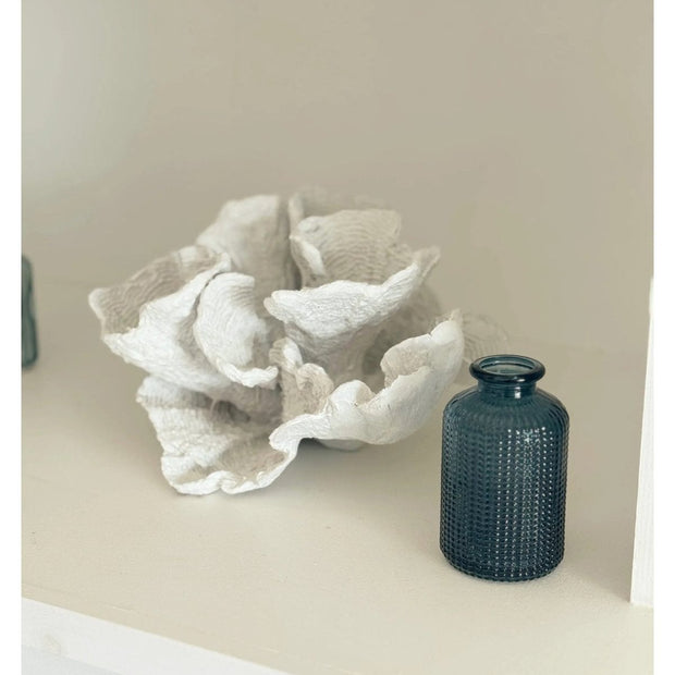 Blue dimpled glass bottle bud vase, Satchville home decor piece with textured design, ideal for floral arrangements or decorative display.