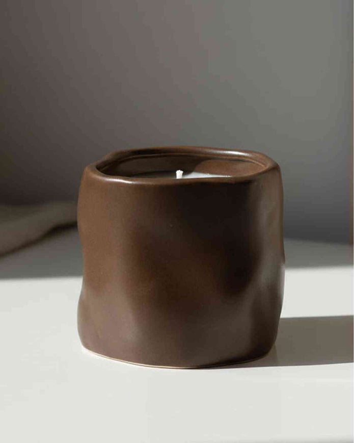 Chocolate brown sculpted candle by Satchville, featuring intricate design, perfect for home decor accents and ambient lighting.