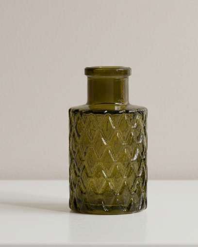 Olive green glass mini ribbed bottle bud vase for home decor, featuring a compact, ribbed design ideal for small floral arrangements.