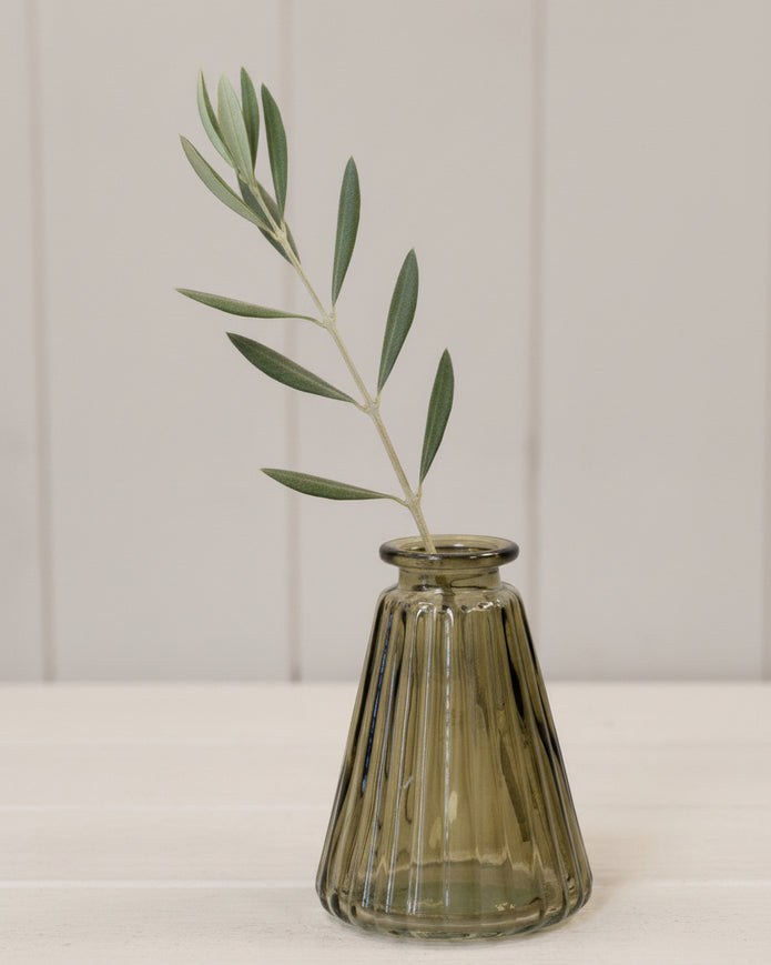 Olive green glass ribbed triangle bottle bud vase, a stylish home decor piece by Satchville with textured surface.