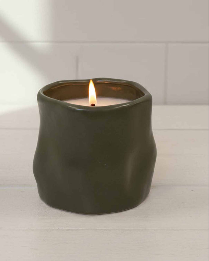 Olive green sculpted candle by Satchville, featured as a stylish home decor piece with intricate detailing.
