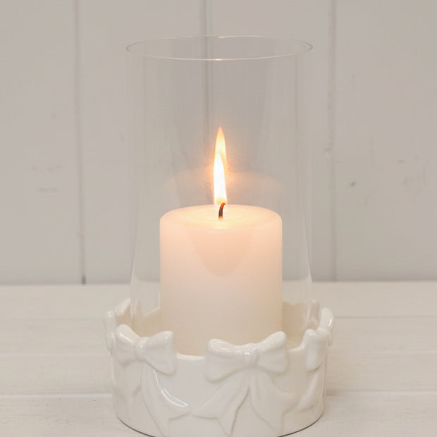 White ceramic bow hurricane vase for home decor, featuring a smooth finish and elegant design by Satchville.