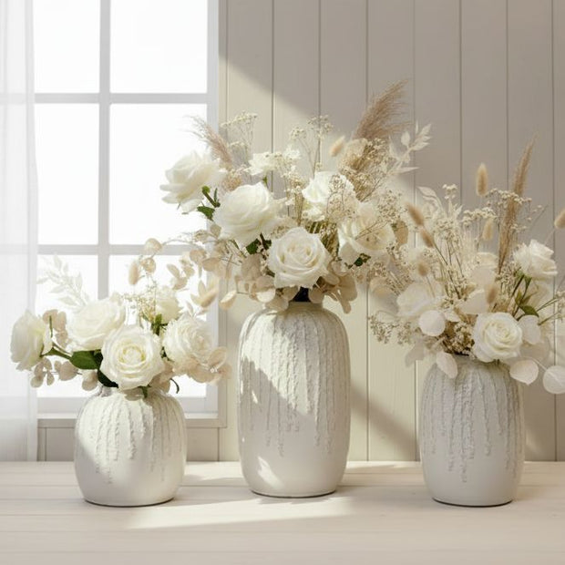 White ceramic vase with trailing leaf print, ideal for home decor, by Satchville, featuring a sleek, modern design.