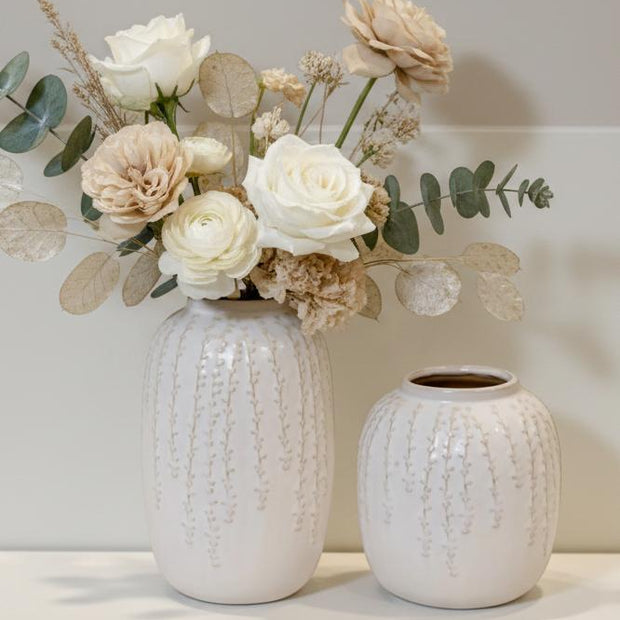 White ceramic vase with trailing leaf print, Satchville home decor piece, medium size, elegant and decorative for interior spaces