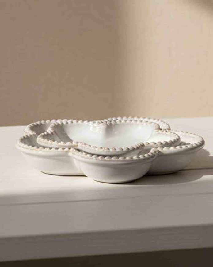 Natural ceramic flower-shaped plate with bobble rim, ideal for home decor, by Satchville, showcasing intricate design and craftsmanship.