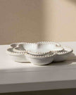 Natural ceramic flower-shaped plate with bobble rim, ideal for home decor, by Satchville, showcasing intricate design and craftsmanship.